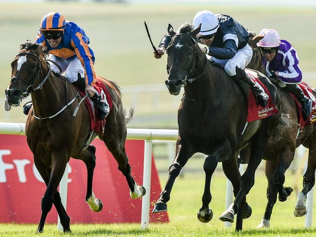 Kildare , Ireland - 30 June 2018; Winner Latrobe, centre, with Donnacha O'Brien up, leads eventual second place finisher Rostropovich, left, with Padraig Beggy up, and third place finisher Saxon Warrior, right, with Ryan Moore up, during the Dubai Duty Free Irish Derby during day 2 of the Dubai Duty Free Irish Derby Festival at the Curragh Racecourse in Kildare. (Photo By Matt Browne/Sportsfile via Getty Images)