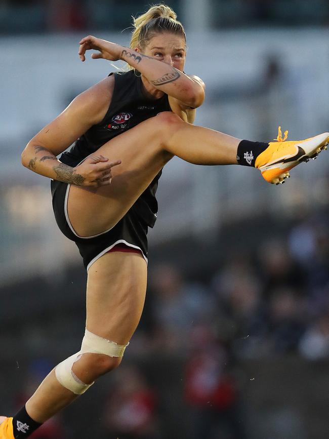 Harris launches a long ball for her current club Carlton.