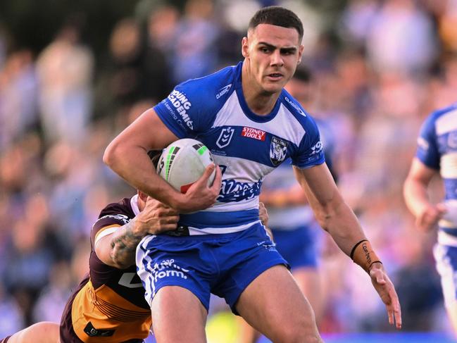 SYDNEY, AUSTRALIA - JULY 15: Jacob Kiraz of the Bulldogs is tackled during the round 20 NRL match between Canterbury Bulldogs and  Brisbane Broncos at Belmore Sports Ground on July 15, 2023 in Sydney, Australia. (Photo by Izhar Khan/Getty Images)