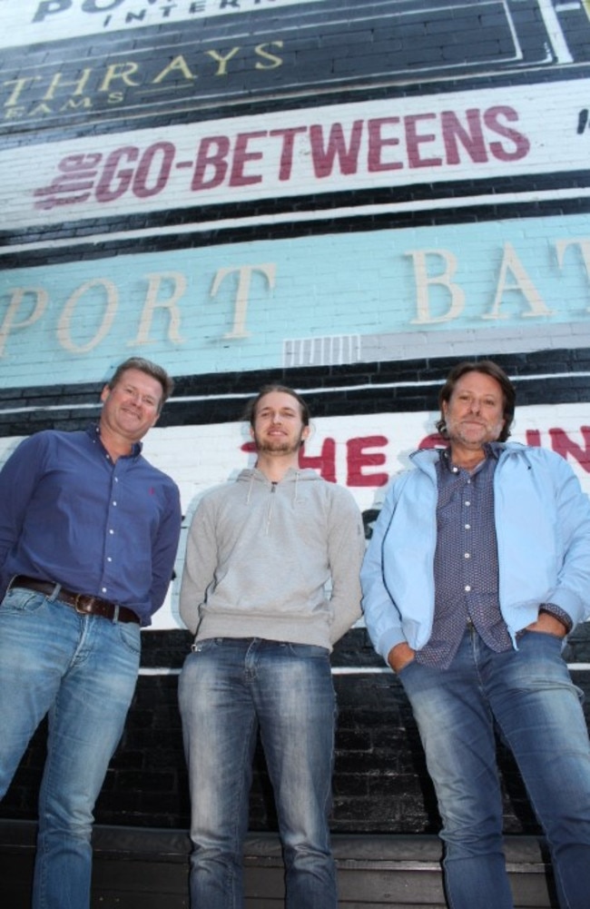 Band Battle '19 organiser Cameron Feltham (left) and former Powderfinger bass player John Collins (right) with rising star Alex Wilson of popular band Shag Rock, which will perform on the night. 