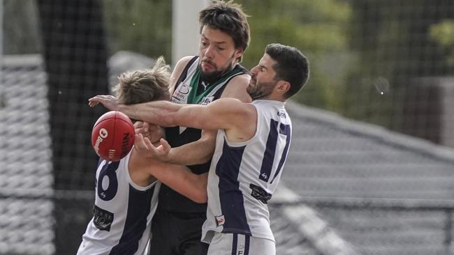 EFL: Donvale’s Zac Haig is the meat in a Coldstream sandwich. Picture: Valeriu Campan