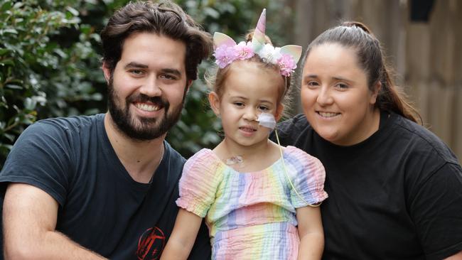 Emily Borg, 4, with dad Brodie and mum Emma at home in Griffin. Picture: Lachie Millard