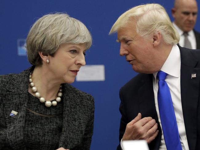 FILE- In this Thursday, May 25, 2017 file photo, U.S. President Donald Trump, right, speaks to British Prime Minister Theresa May during in a working dinner meeting at the NATO headquarters during a NATO summit of heads of state and government in Brussels. U.S. President Donald Trump's visit to Britain next week will take him to a palace, a country mansion and a castle _ and keep him away from noisy protests in London. Prime Minister Theresa May's office says Trump arrives Thursday, July 12, 2018 and will attend a dinner with business leaders at Blenheim Palace, Winston Churchillâ€™s birthplace. (AP Photo/Matt Dunham, Pool, File)