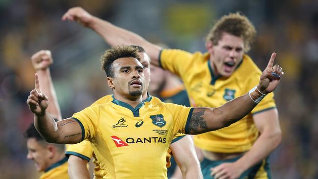 Will Genia of the Wallabies celebrates the win with his team.