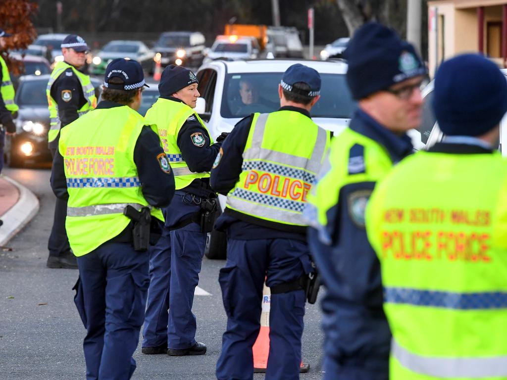 Police in the southern New South Wales border city of Albury check cars crossing the state border from Victoria today. Picture: William West/AFP