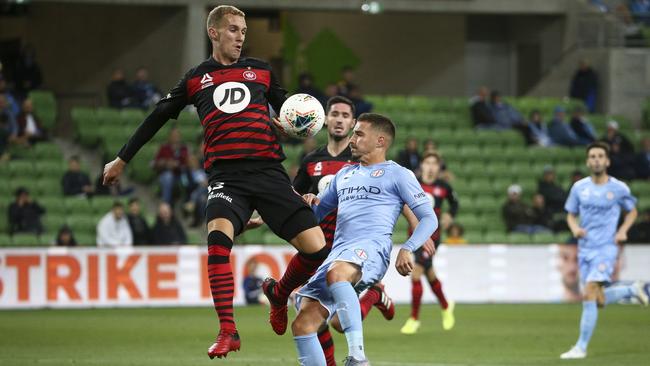Tass Mourdoukoutas, left, of Western Sydney Wanderers and Jamie Maclaren of Melbourne City compete for the ball during the round-23 A-League match on Saturday. Picture: Getty Images