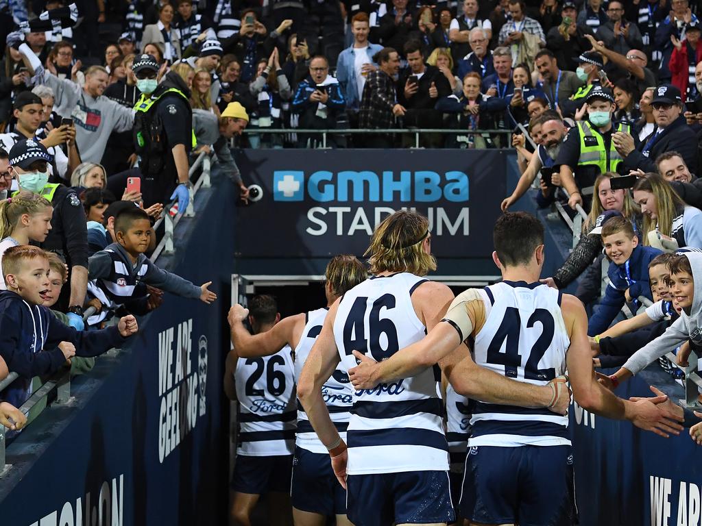 Players and fans in Geelong Friday night.