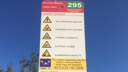 A warning sign at the beach in Caloundra.