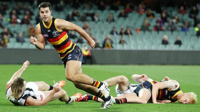 Adelaide’s Darcy Fogarty is left standing as Lynden Dunn, Elliott Himmelberg and Jordan Roughhead all fall to the ground. Picture: Sarah Reed