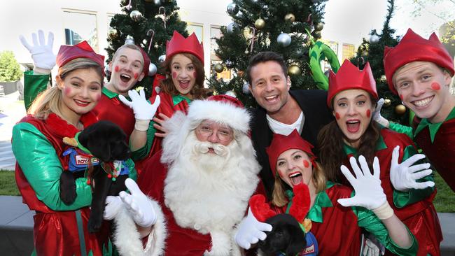 Santa gets some help from his many elves. Picture: Stuart Milligan