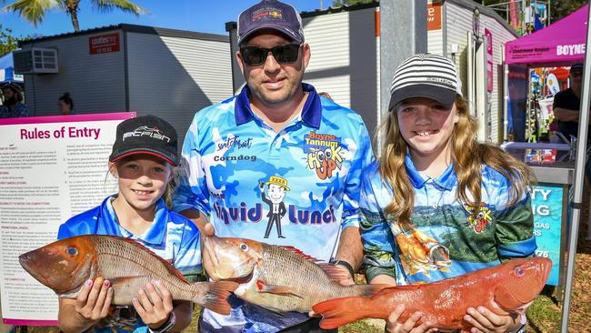 Andy Cornelissen with Olivia, 9 and Sophie, 11 with coral trout and red throat at the afternoon weigh-in on day three of the 2019 Boyne Tannum HookUp, at Bray Park Boyne Island.