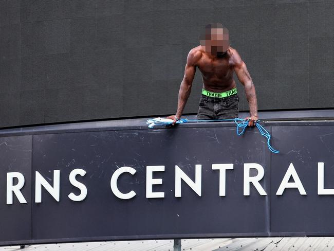 Emergency services personnel attend a scene at Cairns Central Shopping Centre, where a man scaled onto the awning of the centre and refused to come down. Police have set up a Public Safety Declaration Zone around the intersection of Shields and McLeod Street. Picture: Brendan Radke