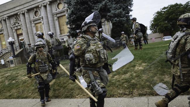 Members of the Army National Guard are seen in Downtown Kenosha during a visit to the area by President Trump. Picture: Angus Mordant