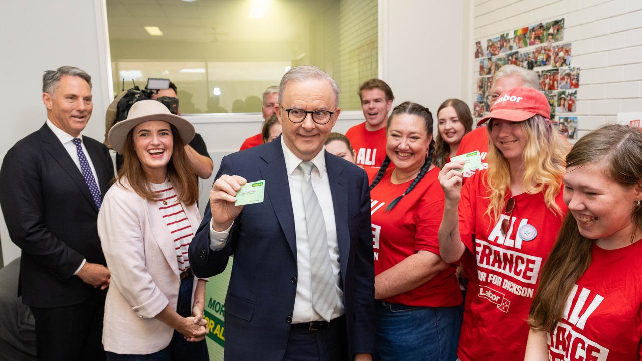 Anthony Albanese and Ali France volunteers got out their Medicare cards during a stop at Ms France’s campaign headquarters in Dickson. Picture: Jason Edwards / NewsWire