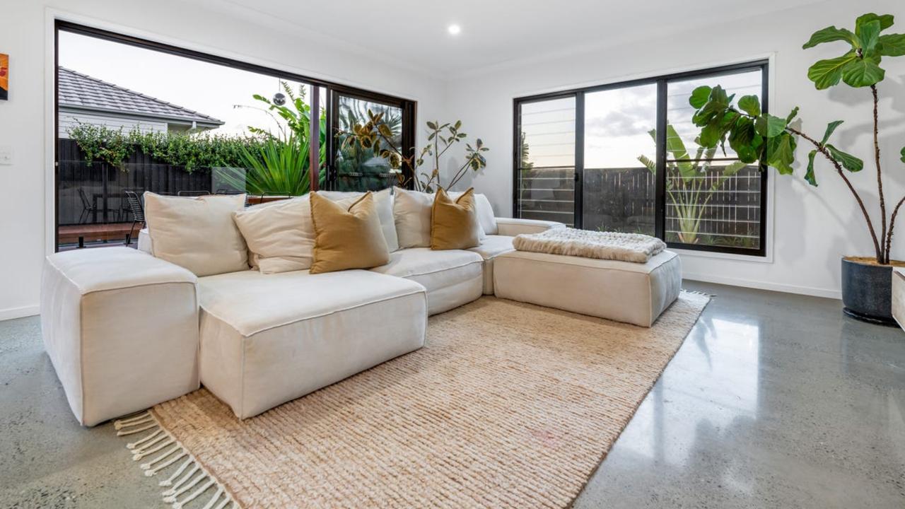 Polished concrete floors add to the cool contemporary feel of the 2016-built house