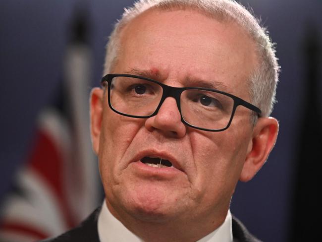 Australia's former prime minister Scott Morrison speaks to media during a press conference in Sydney on August 17, 2022. - Australia's Prime Minister Anthony Albanese on August 16 said that his predecessor Scott Morrison secretly seized control of five ministerial posts, labelling it an "unprecedented trashing of our democracy". (Photo by Steven Saphore / AFP)