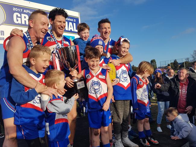 Blair (cousin), Shane and Brent Harvey celebrate North Heidelberg's 2017 premiership. Picture: Tim Michell.