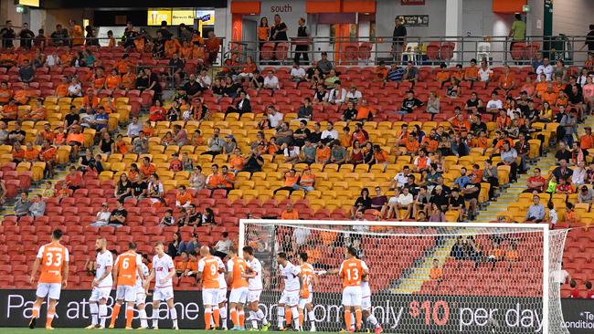 A small crowd looks on during the round 2 A-League match between the Brisbane Roar and Adelaide United at Suncorp Stadium.