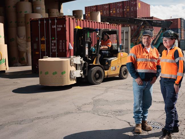 Nigel Hay, warehouse manager at Tasmanian paper mill Norske Skog with staff member Claire Glover, at the mill which is facing challenges due to shipping surcharges.25/11/2024photo - Peter Mathew