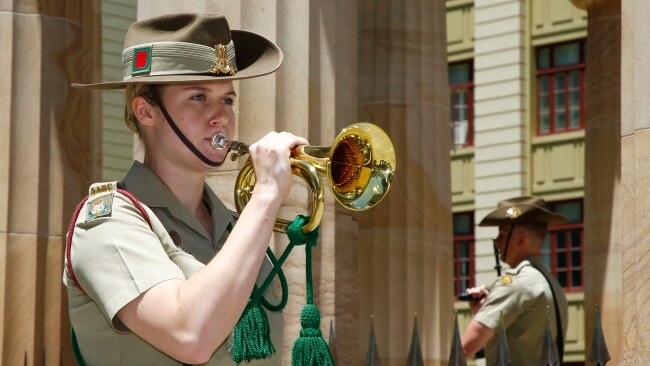 A member of the defence force plays the Last Post during the Remembrance Day service in Brisbane. Picture: NCA NewsWire/Tertius Pickard