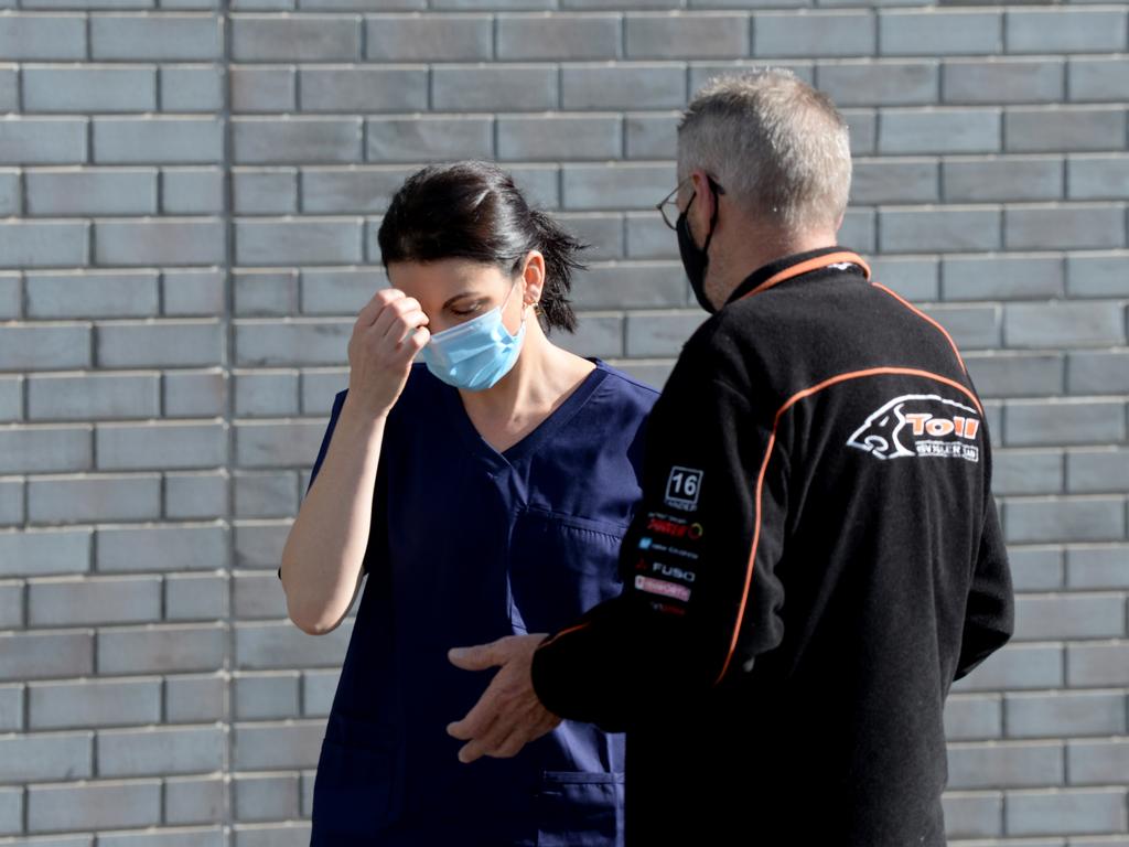 Colin Cowen speaks to nurses outside Epping Gardens Aged Care Home. His mother Audrey Gardiner was a resident at the facility until a few days ago. Picture: Andrew Henshaw