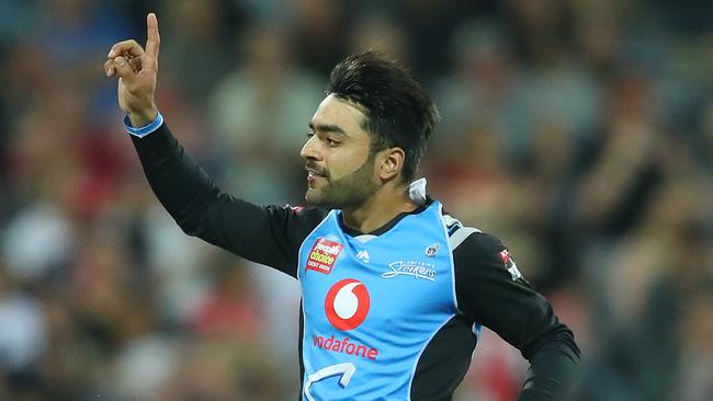 Rashid Khan of the Strikers celebrates after dismissing Cameron White of the Renegades on Thursday. Picture: Scott Barbour/Getty Images