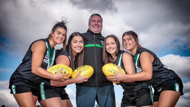 Donvale footballers Jess Perna, Emily Miller, Sara Miller and Zoe Perna with coach Clint Martin.