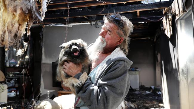 George Rudonski, 58, was saved by his Pomeranian Gucci from a house fire last night at their home on Dargie Place in Eagle Vale. Around 11pm last night, firefighters attended a property in Eagle Vale after reports of a fire. The property was found severely damaged and the homeowner escaped almost unscathed, hospitalised for smoke inhalation. The man's little pomeranian saved his life by alerting him to the fire. Picture: Jonathan Ng