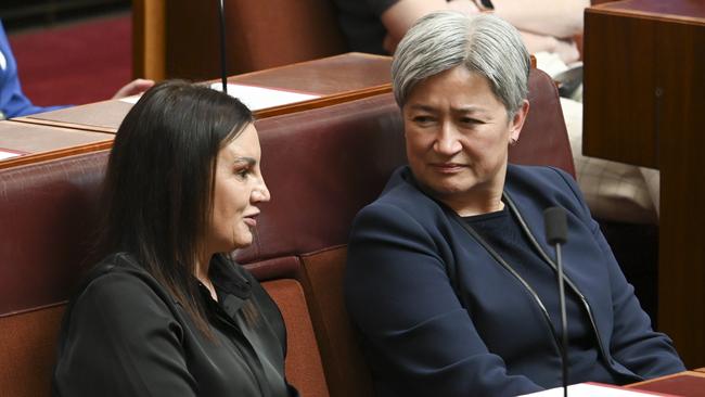 Jacqui Lambie confers with Penny Wong on Wednesday. Picture: NewsWire / Martin Ollman