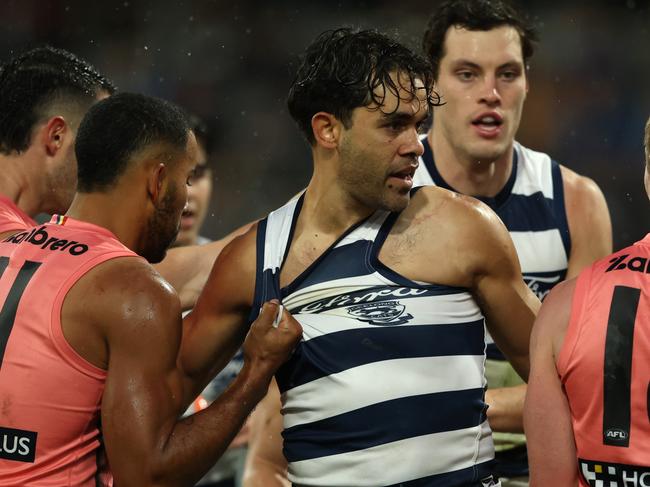 GEELONG, AUSTRALIA - JUNE 07: Jack Martin of the Cats has words with Matt Rowell of the Suns during the round 13 AFL match between Geelong Cats and Gold Coast Suns at GMHBA Stadium, on June 07, 2025, in Geelong, Australia. (Photo by Robert Cianflone/Getty Images)