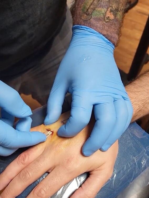 The stunt is made possible by a chip called a Vivokey Apex, which uses the same “tap-to-pay” feature that enables Apple Pay on iPhones. Picture: Twitter/@BrandonDalaly.
