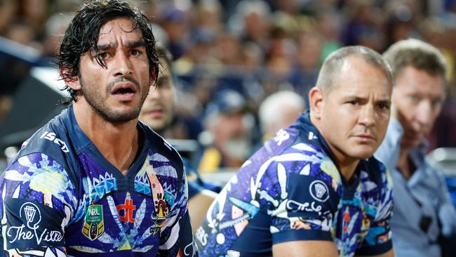 An injured Johnathan Thurston watches the Cowboys from the bench.