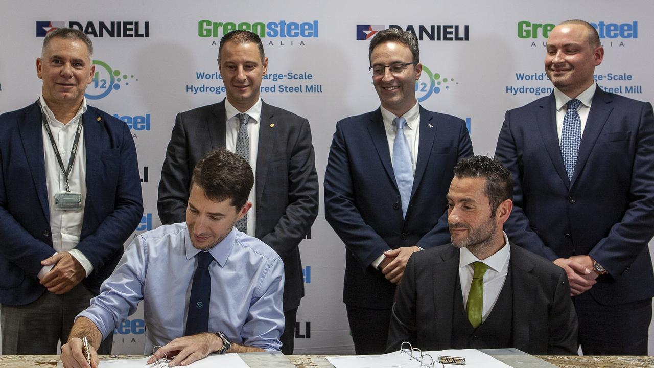 \Greensteel Australia president and executive director Mena Ibrahim (standing far right) and chief executive of Greensteel Australia and Reosteel Romany Ibrahim seated far right. Danieli Group chief executive officer Giacomo Mareschi seated on left. Picture: Supplied