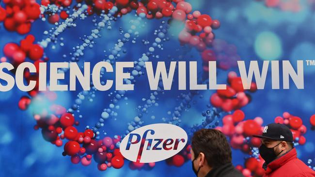 People walk past the Pfizer Inc. headquarters in New York City. Picture: AFP