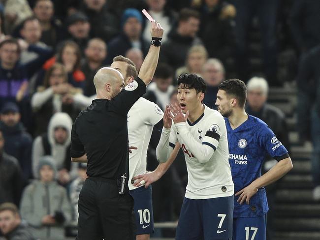 Referee Anthony Taylor shows a red card to Tottenham's Son Heung-min during the English Premier League soccer match between Tottenham Hotspur and Chelsea, at the Tottenham Hotspur Stadium in London, Sunday, Dec. 22, 2019. (AP Photo/Ian Walton)