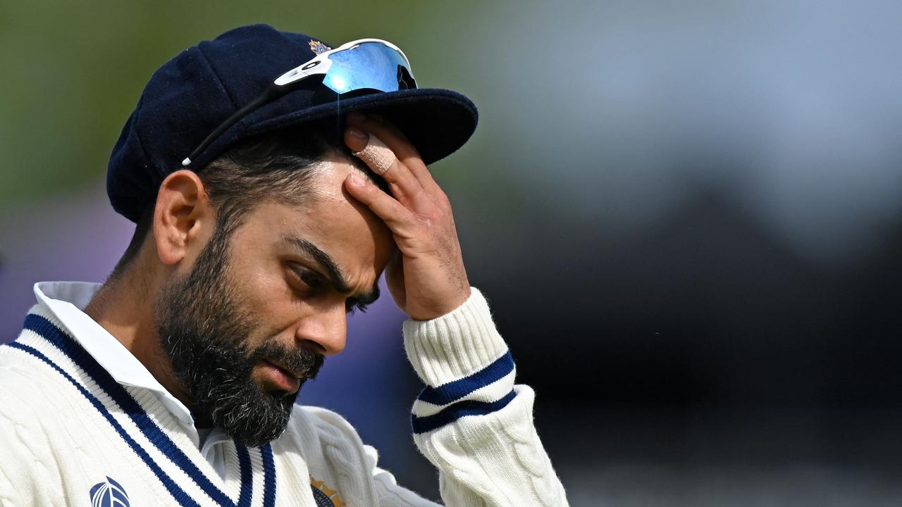 India's Virat Kohli reacts as he walks back to the pavilion at the end of New Zealand's innings on the fifth day of the ICC World Test Championship Final between New Zealand and India at the Ageas Bowl in Southampton, southwest England on June 22, 2021. (Photo by Glyn KIRK / AFP) / RESTRICTED TO EDITORIAL USE