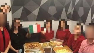 An unidentified branch celebrating Italy’s win in the Euros with an unmasked team lunch.