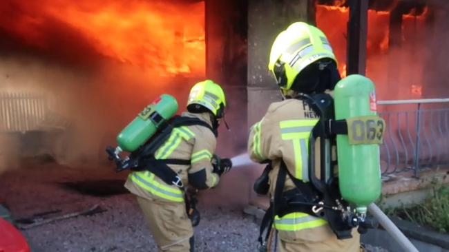 Firefighters battle a blaze in Doonside, in Sydney's west. Photo: FRNSW