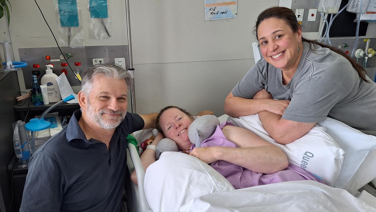 Marita Finch with her husband David Finch and her best friend Belinda King in hospital following her motorcycle crash. Picture: Supplied