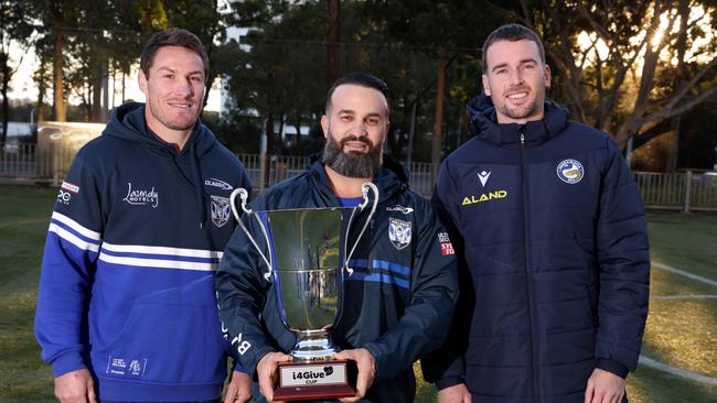 Danny Abdallah with with the I4Give Cup alongside Bulldogs Captain Josh Jackson (:) and Parramatta Eels captain Clint Gutherson (R). Picture: Damian Shaw