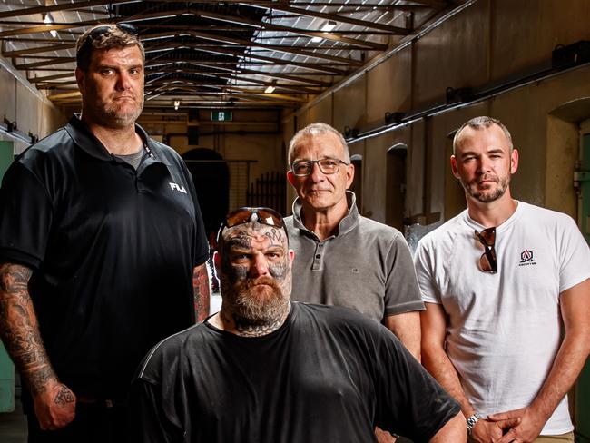 Former Finks MC members Tyson and Matt Ward (sitting), Henry Keogh and Arcofyre Founder and CEO Kirby Brownlow at the Old Adelaide Jail on November 25, 2020 in Adelaide. Picture Matt Turner.