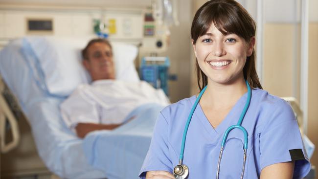 Portrait Of Nurse With Patient In Background