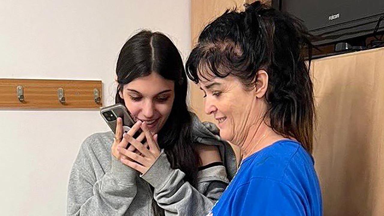 Natalie and Judith Raanan speaking on the phone with Joe Biden. Picture: US Embassy in Jerusalem/AFP