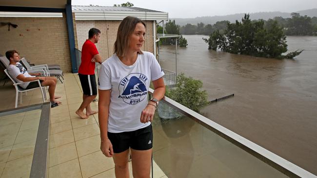 Sydney continues to be drenched in heavy rains causing flooding in local areas and the Warragamba Dam to overflow, sending millions of litres of water down the Nepean River to low lying areas like Emu Plains. Heidi Van Den Broek and her family watch the flood levels rise from the balcony of their Bellevue Rd home on the banks of the Nepean River in Regentville. Picture: Toby Zerna