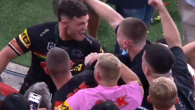 Nathan Cleary celebrates with a group of men following the Panthers’ win in the NRL grand final at Suncorp Stadium. Picture: Channel 9