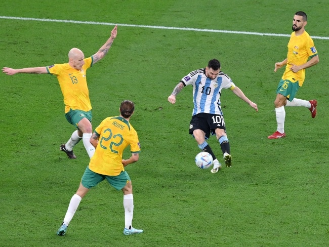 Lionel Messi of Argentina shoots the ball against Aaron Mooy of Australia during the FIFA World Cup Qatar 2022 Round of 16 match between Argentina and Australia in Doha, Qatar. Picture: Getty Images