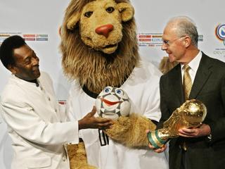 Former soccer player Pele (l) with Franz Beckenbauer, head of 2006 World Cup organising committee, unveiling lion puppet "Goleo VI" and "sidekick" talking soccer ball "Pillie" - official mascots of 2006 soccer World Cup in Germany 13 Nov 2004. six