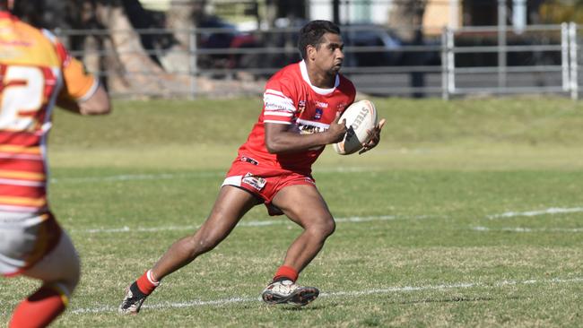 Rebels' young flier Tom McGrady takes off around a defender during the South Grafton Rebels and Coffs Harbour Comets Group 2 major semi-final at McKittrick Park.