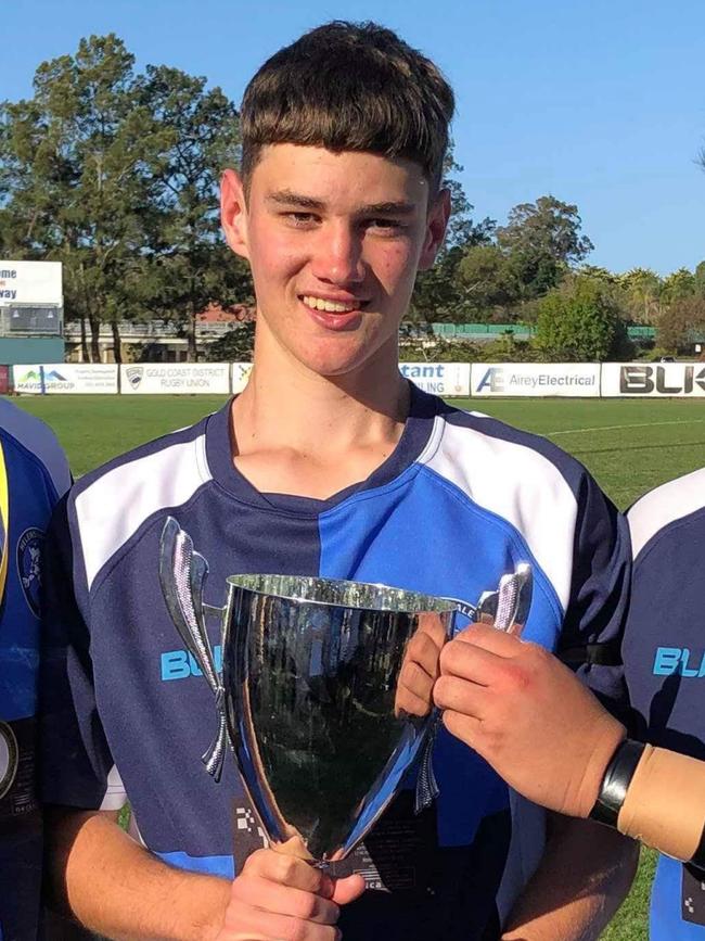 Helensvale Hog Jaxon Arnold poses with the Radio Metro U17’s Grand Final Cup. Picture: Supplied