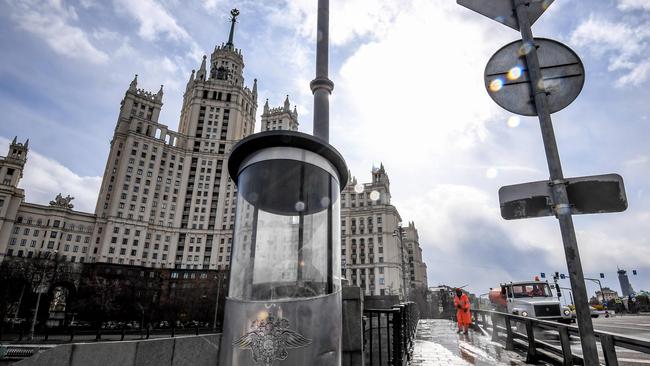 A municipal worker sprays disinfectant in central Moscow. Picture: AFP